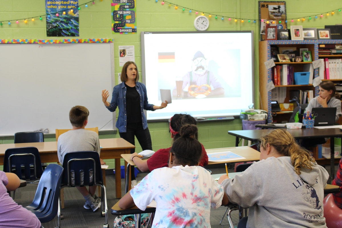 Presenter sharing about Germany in a classroom
