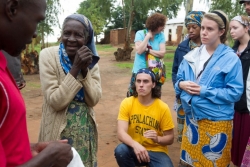Blessing Chikakula (far left) interprets for Appalachian students as they visit with William Kamkwamba's grandmother in Wimbe Village.