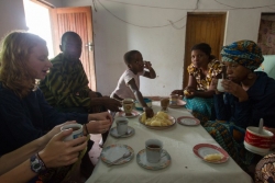 Anja Wicker and Alex White share a breakfast of taro root, nsima and tea at their home stay visit.