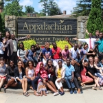 Fellows in front of the Appalachian Welcome Sign