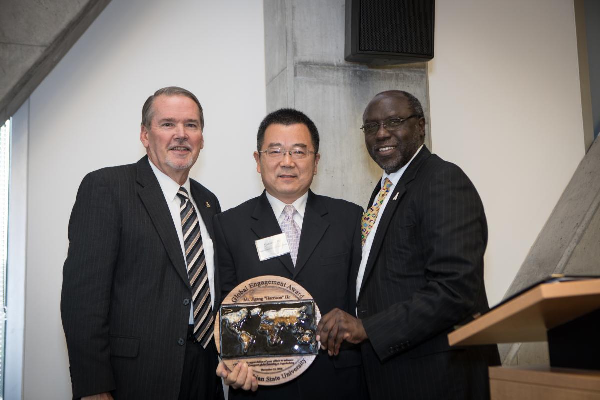 Harrison He Poses With Randy Edwards and Jesse Lutabingwa